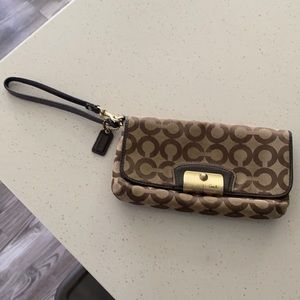 Coach signature wristlet with rose colored lining